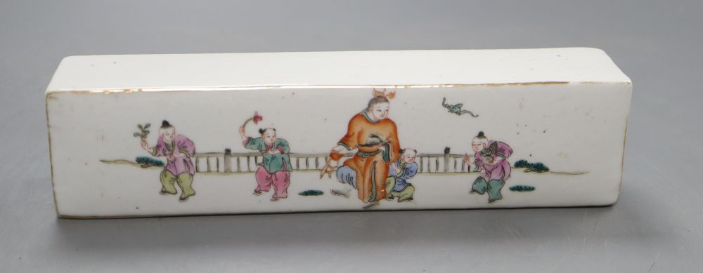 A Chinese famille rose scroll weight, length 21cm